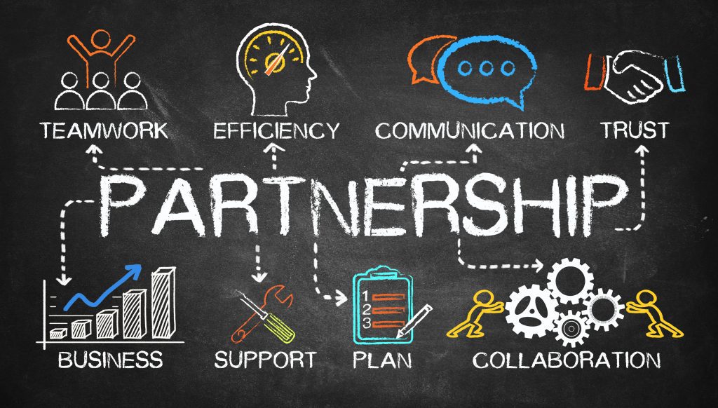 Colorful chalkboard drawing illustrating key elements of partnership like trust, efficiency, and communication.