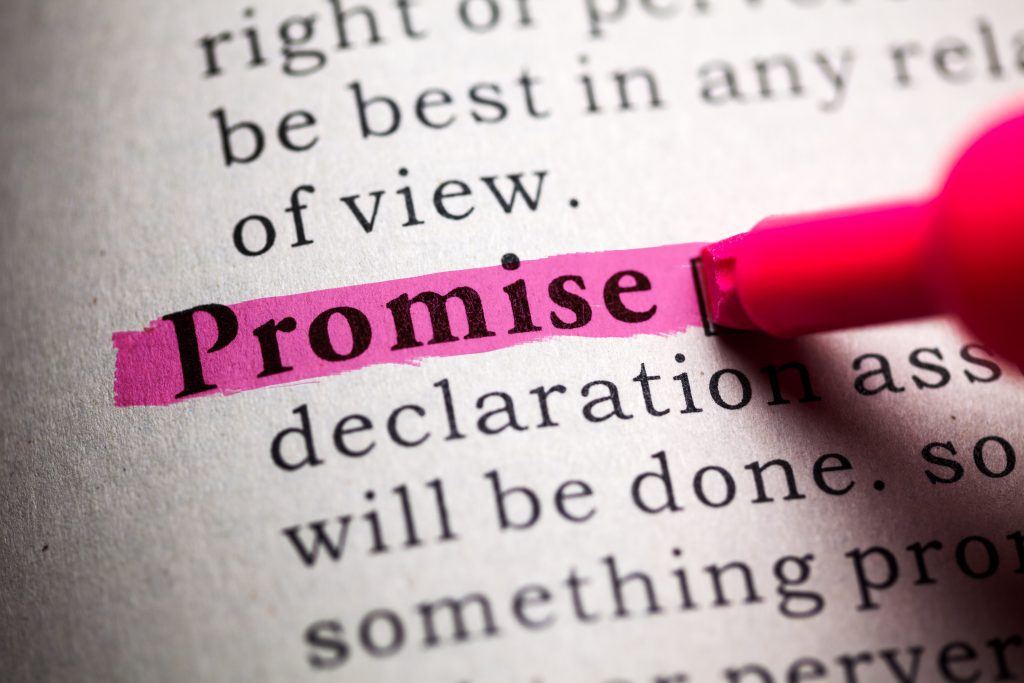 The word 'Promise' highlighted in pink in a dictionary.